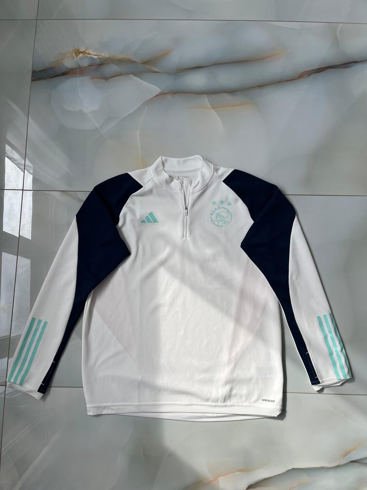 A seller's photo of an adidas Ajax Amsterdam training top